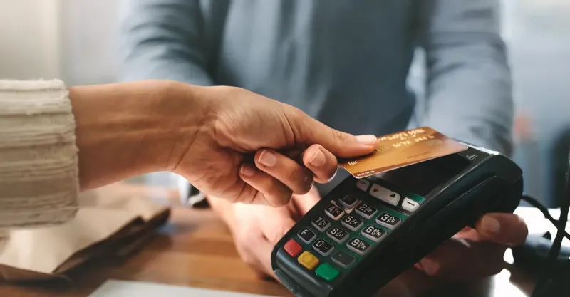 woman holding credit card